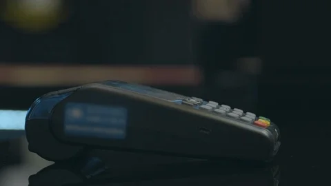 Close up hand man use credit card terminal store machine hand commerce shopping Stock Footage 107533699