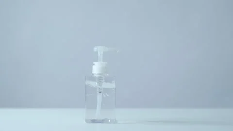 Close up hand of a man is using alcohol gel  over white background Stock Footage 137064535