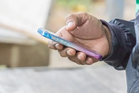 Close up hand of a man using mobile smart phone, copy space for text. technol Stock Photos
