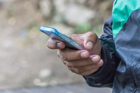 Close up hand of a man using mobile smart phone, copy space for text. technol Stock Photos