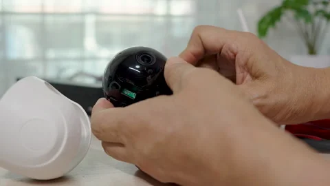 Close-up hand of man using screwdriver to repairing a wireless CCTV camera. Stock Footage 326299089
