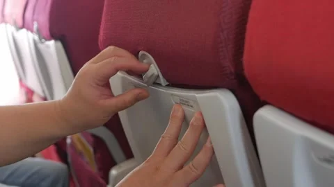 Close up to hand of a man while inside airplane cabin and closing airplane'.. Stock Footage 313821714