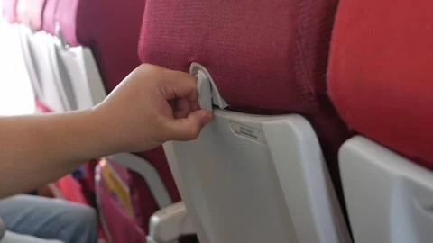 Close up to hand of a man while inside airplane cabin and open airplane's f.. Stock Footage 316391535