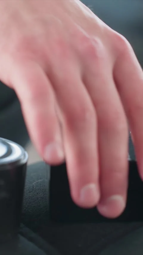 Close up of hand manipulating black cylindrical applicator with foam cover on Stock Footage 343084419