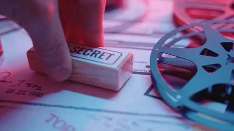 Close up on hand marking paper with official red Top Secret rubber stamp Stock Footage 240649369