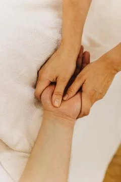 Close up of hand massage therapy session. Female massage therapist's hands. 写真素材