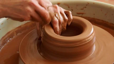 Close-up of the hand of a master potter working on a potter's wheel Stock Footage 235758807