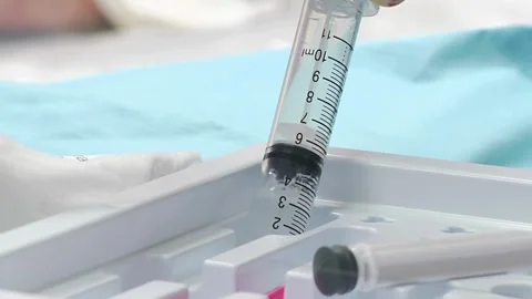 Close up hand of medical staff to preparing anesthesia in dentistry Female Stock-Footage 336587048