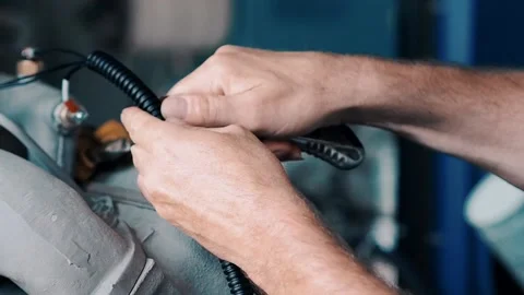 A close up of a hand mending the engine Stock-Footage 130336228