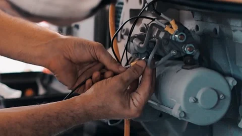 A close up of a hand mending the engine Stock-Footage 130348866
