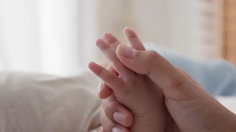 Close up of hand mother touch palm little boy her in the morning light Stock Footage 164597593