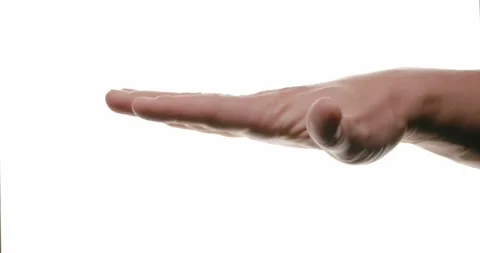 Close-up of hand in motion on white background Stock Footage 293674771