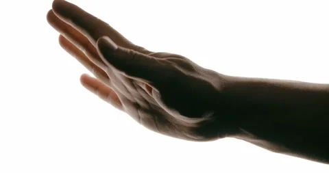 Close-up of hand in motion on white background with contrast lighting Stock Footage 293675047