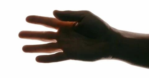 Close-up of hand in motion on white background with contrast lighting Stock Footage 293675224