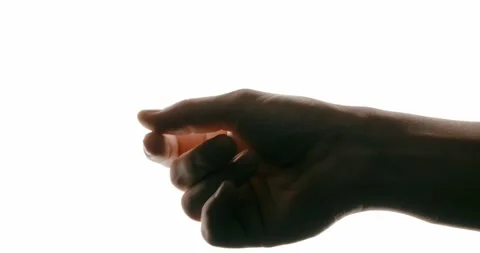 Close-up of hand in motion on white background with contrast lighting Stock Footage 293675303