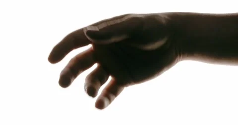Close-up of hand in motion on white background with contrast lighting Stock Footage 293675347