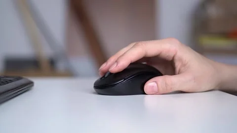 Close-up hand moves the computer mouse at the desktop Stock Footage 152768447