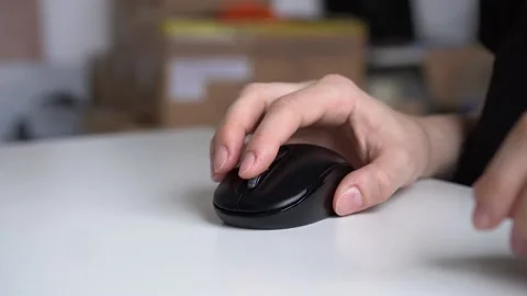 Close-up hand moves the computer mouse at the desktop Stock Footage 152769957