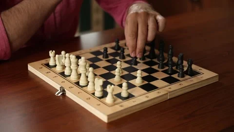 Close Up of Hand Moving Chess Piece on Chessboard Stock Footage 332639773