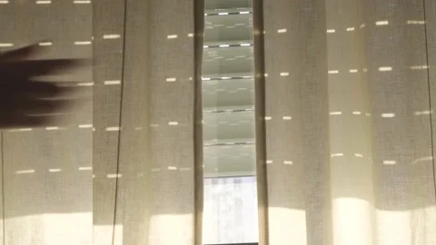 Close up of hand moving the window blinds and a person peeking through. Lady 库存影片 148999820