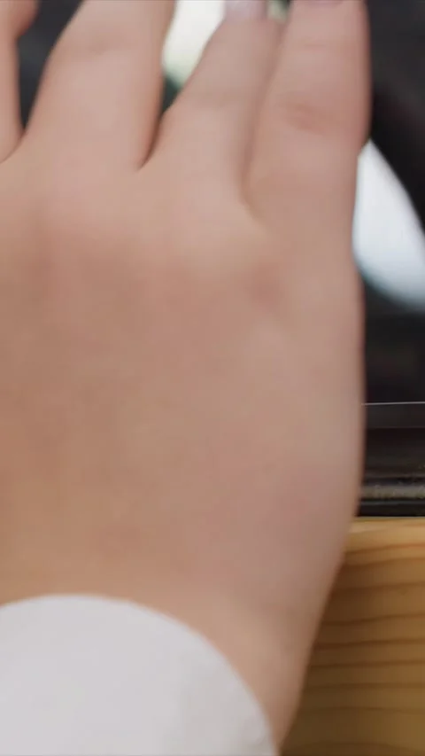 Close up of hand with nail polish interacting on electronic device screen Stock Footage 347624622