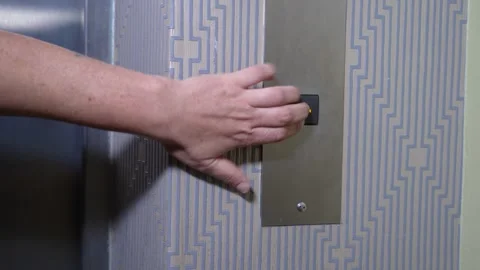 Close-up of a hand nervously pressing the elevator button 動画素材 287152702