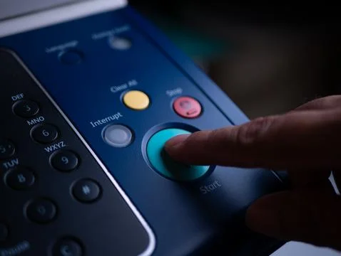 Close up hand office man press start button on panel to using the Office pr.. Stock Photos