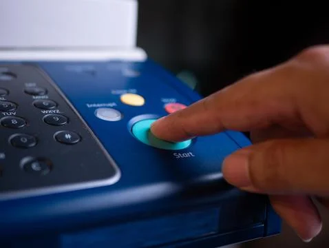 Close up hand office man press start button on panel to using the Office pr.. Stock Photos