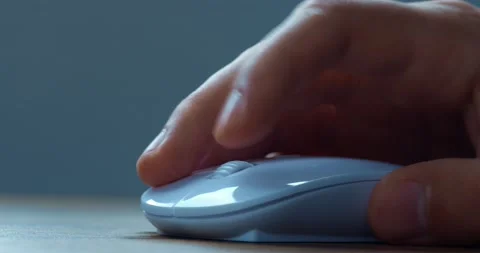 Close up hand of office worker actively using a computer mouse while working in Stock Footage 230662137