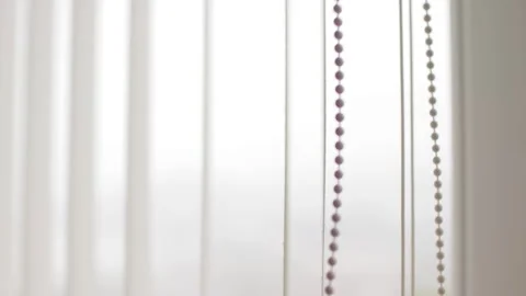 Close-Up of Hand Opening And Closing Vertical White Blinds at the Window, soft Stock Footage 308851998