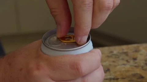 Close up of a hand opening a beer can Stock Footage 130266765
