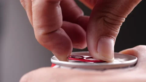 Close-up of hand opening can of cold beer Stock Footage 134660051
