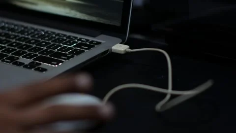Close Up of Hand Opening Laptop on Desk with Wired Mouse Connected Stock Footage 340346126