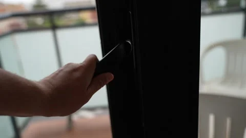 Close Up of Hand Opening Modern Window Handle at Home Stockbeeldmateriaal 341293030