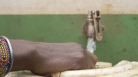 Close up of hand opening water tap to fetch clean water. Stock Footage 320346279