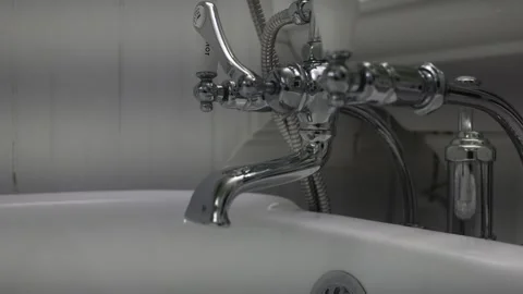 Close-Up of Hand Operating Fancy Water Faucet with Dripping 01 Video stock 289630870
