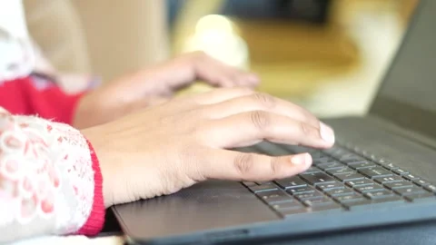 Close-Up of Hand Operating Laptop in Workplace Environment Stock Footage 325528800