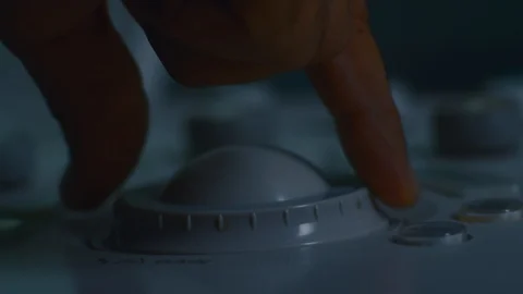 Close up of hand operating a machine Stock Footage 105819657