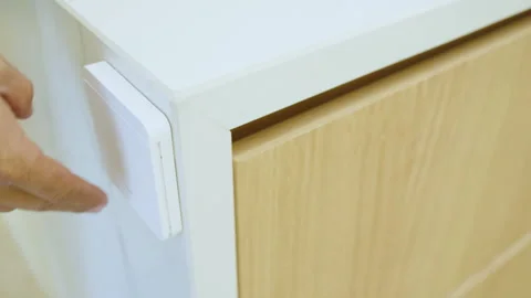 Close-up of a hand operating a switch to turn LED lights on and off Stock Footage 342473054