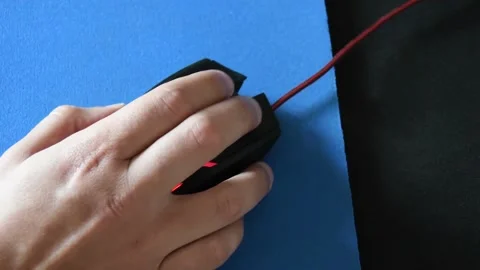 Close-up of a hand operating a video game mouse Stock Footage 139650254