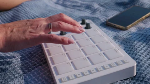 Close Up Hand Operating White Portable Midi Drum Pad Sound Controller Stock Footage 342770389