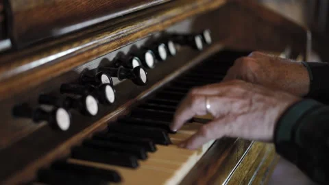 Close up. Hand of organ player playing keyboard of old church organ. Stock Footage 130841275