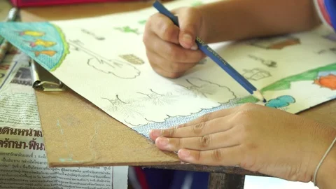 Close up hand paint  on  book Stock Footage 106576719