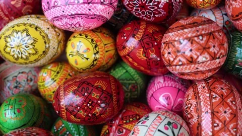 Close-up of hand-painted Easter eggs adorned with intricate folk designs in brig Stock Footage 306677610