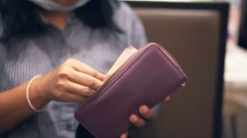 Close up hand paying bill. Slow motion Stock Footage 99536232