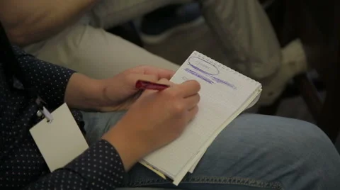 Close-up of hand pen writes in a notebook Stock Footage 64621116