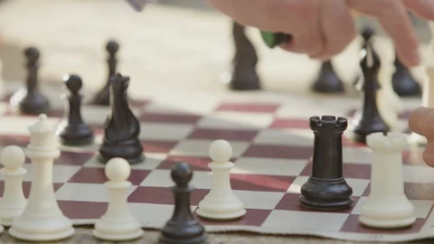 Close-up of hand of a person playing chess Stock Footage 103428133