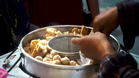 Close up of hand picking up meetball Stock Footage 325441003