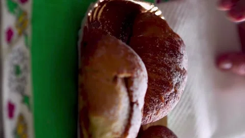Close-up of hand picking sfogliatella pastry, vertical 스톡 동영상 276679334