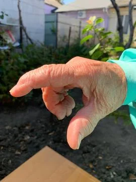 Close-Up of Hand in Pinch or Grasp Gesture Stock Photos